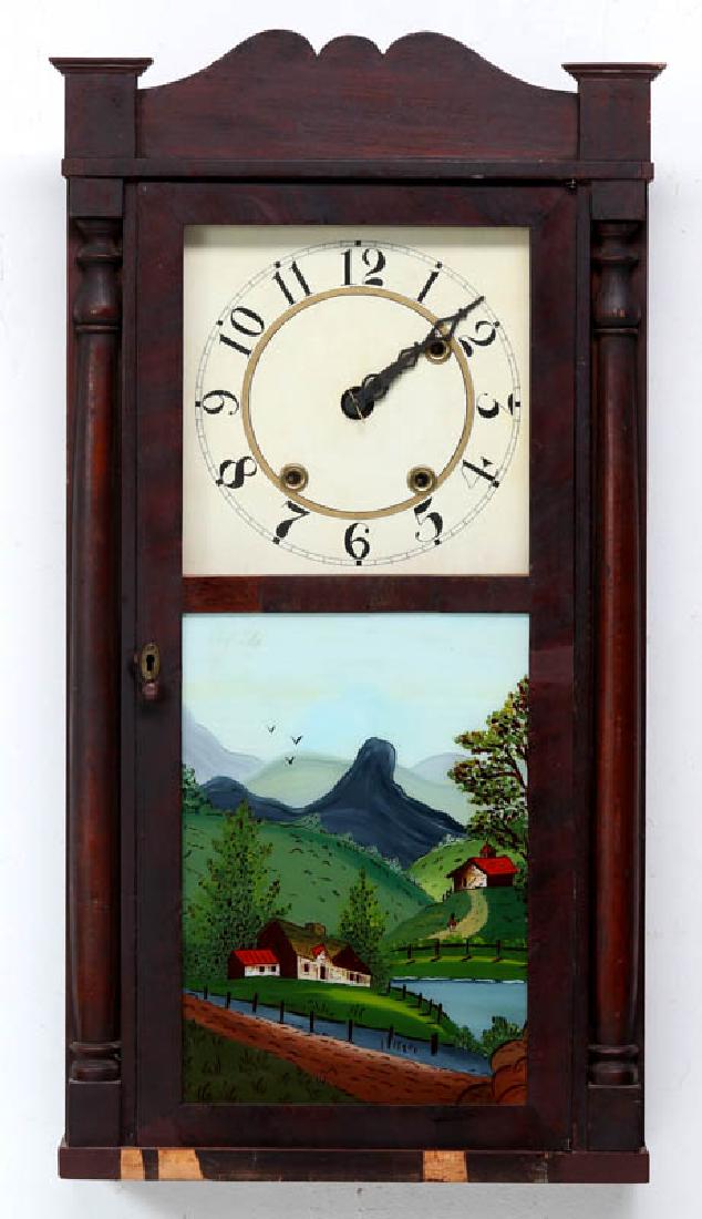 A DANIEL PRATT THIRTY-HOUR COLUMN CLOCK: A 19th century clock with turned wood half-columns, reverse painted door, dial with Arabic numerals, time and strike, signed with a paper label inside. Measures 31.5 x 16.75 x 5 inches. We happily pro