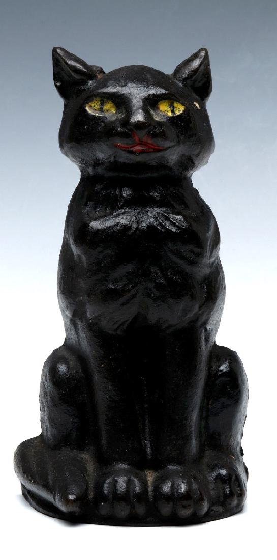 A NATIONAL/ALBANY BLACK CAT CAST IRON DOORSTOP: A circa 1920s single-sided black cat doorstop with polychrome details, unsigned. This design was produced by both the National Foundry #36 and Albany #176. Measures 6.5 x 3 x 2.25 inches. We happily p