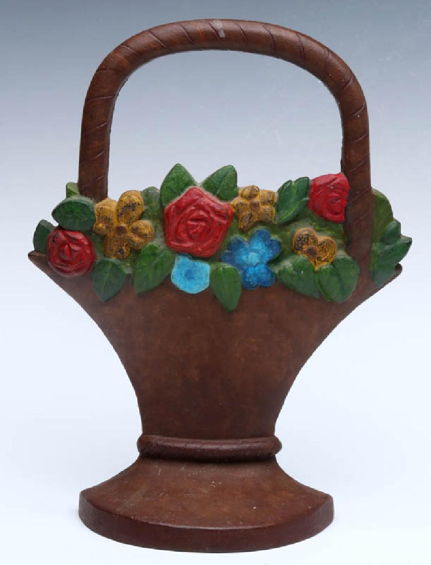 A HUBLEY MIXED FLOWER BASKET DOORSTOP NO. 3: A single-sided polychrome doorstop, Hubley Mixed Flower Basket #3, unsigned. Measures 10.25 x 7.75 x 2.5 inches. We happily provide seamless in-house packing and shipping services on nearly everything