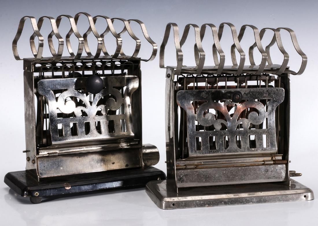 TWO MANNING BOWMAN ELECTRIC TOASTERS WITH RACKS: Manning Bowman Article No 1209 with toast warming rack, marked, 'Manning Bowman Quality, Article No 1209, Meriden, Conn. Pat: Feb 6, 06.' Also a Manning Bowman Article No 1210 with toast warming rack.
