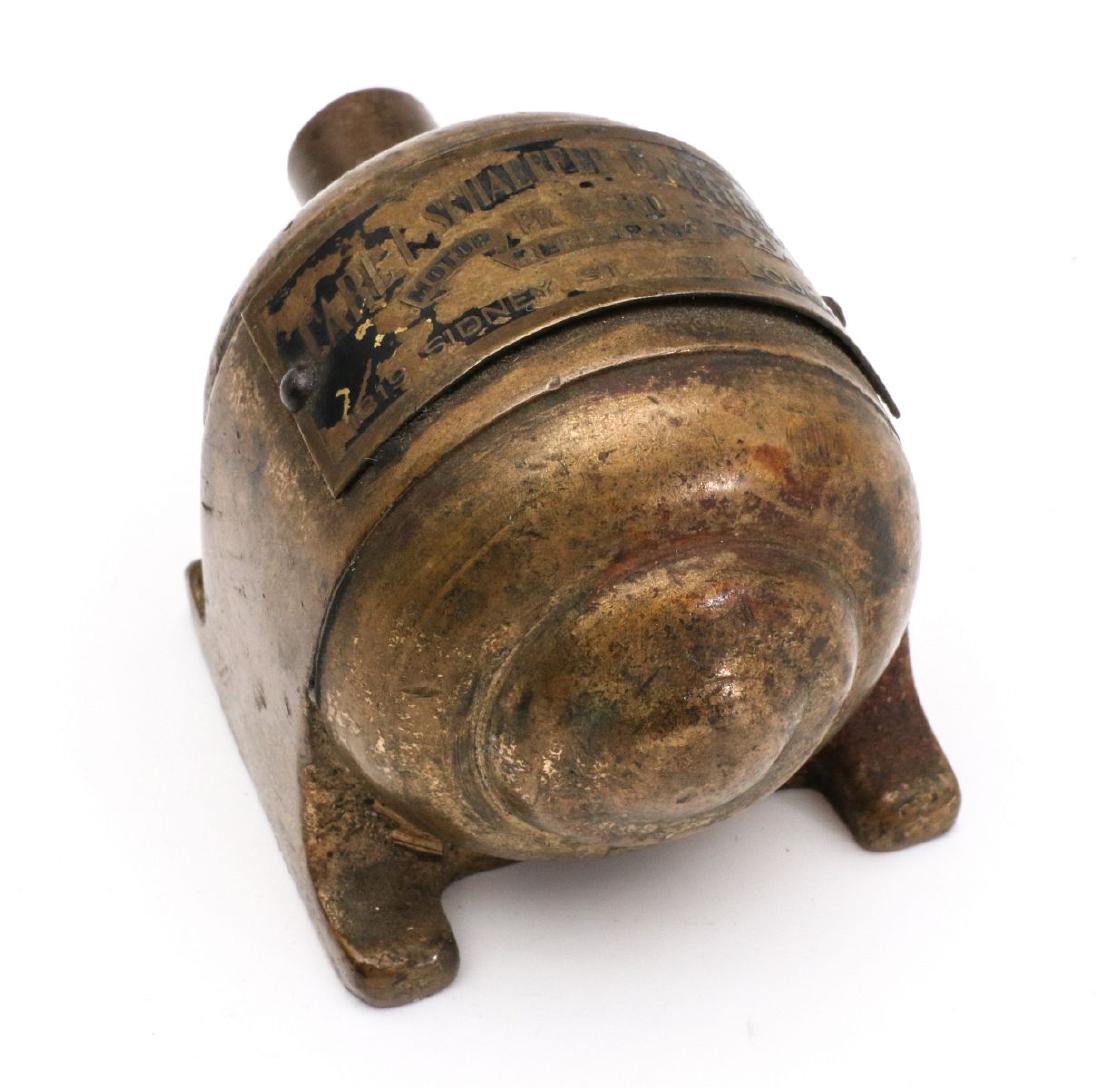 A CARL SCHAEFFER FIGURAL BRASS MOTOR PAPERWEIGHT: Heavy cast brass, signature tag of 'Carl Schaeffer Electric Co, Motor Sales Repairing PR3-5800 1819 Sidney St, St Louis MO.' Approx 2.25 inches long by 1.75 inches wide by 2 inches tall. We happily pr
