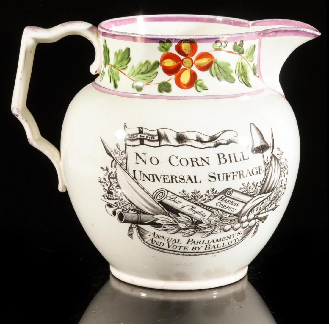 A LUSTRE JUG: PETERLOO MASSACRE AND CORN BILL 1819: 1820s A Liverpool-type jug with lustre trim and floral decoration, black transfer commemorating NO CORN BILL UNIVERSAL SUFFRAGE as well as a map and commemoration of the Peterloo Massacre 1819. Measur
