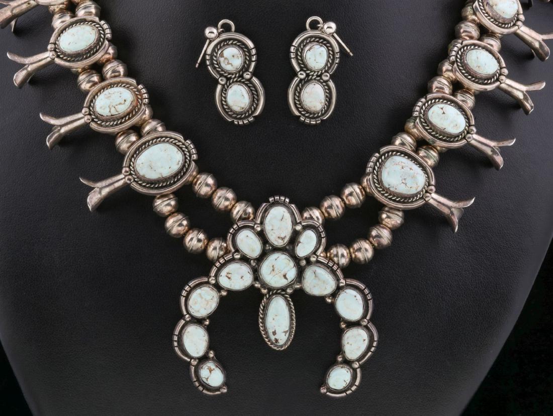 A STERLING AND TURQUOISE SQUASH BLOSSOM SET (1 of 12)