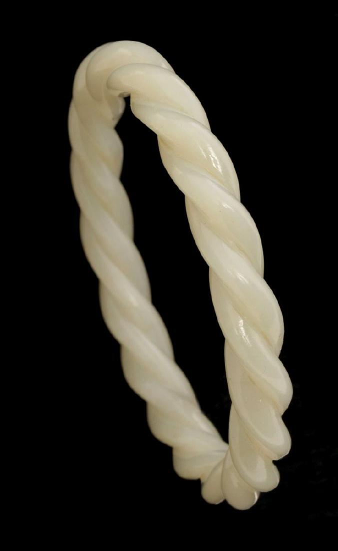 A CARVED ROPE TWIST MOTIF JADE BANGLE BRACELET (1 of 3)