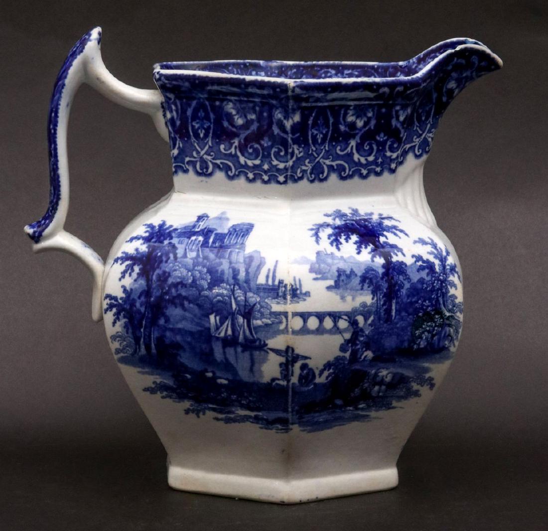 A TIVOLI PATTERN FLOW BLUE IRONSTONE PITCHER: A Tivoli pattern pitcher signed with an impressed 'Real Ironstone' mark. Measures 8.25 inches. We happily provide seamless in-house packing and shipping services on nearly everything we sell.
