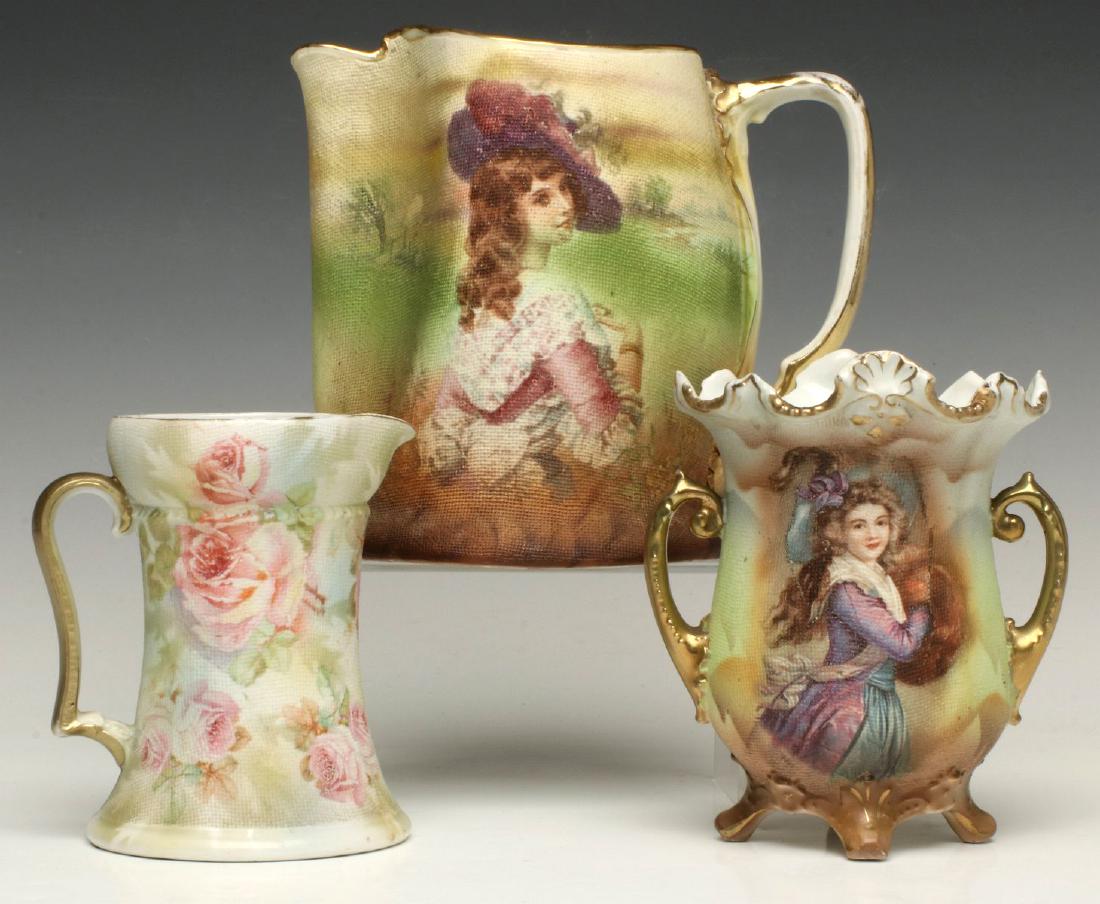 ROYAL BAYREUTH SCENIC TAPESTRY VASE AND PITCHERS: Pink American Beauty Roses, Portrait Lady and Muff Lady, signed with inkstamps on the bases. Largest pitcher measures 5.25 x 5.5 inches, smallest measures 3.75 x 3.25 inches. We happily provide seamle