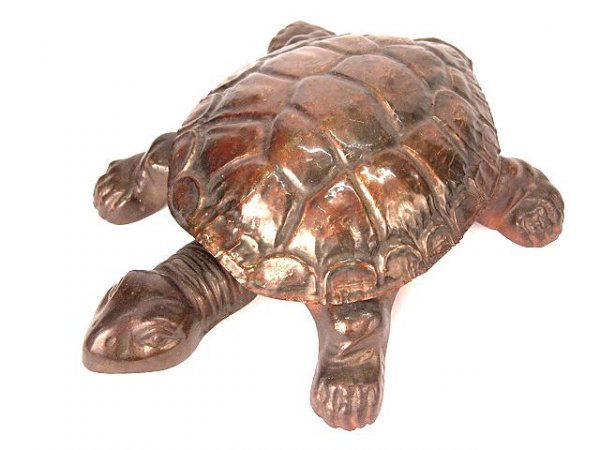 ANTIQUE MECHANICAL TURTLE SPITTOON: Antique spittoon in the shape of a turtle. It has cast iron legs and head with a copper flash "Shell". Pressure on the head lifts the hinged shell to reveal the spittoon. Measures 13" long by 11" wide