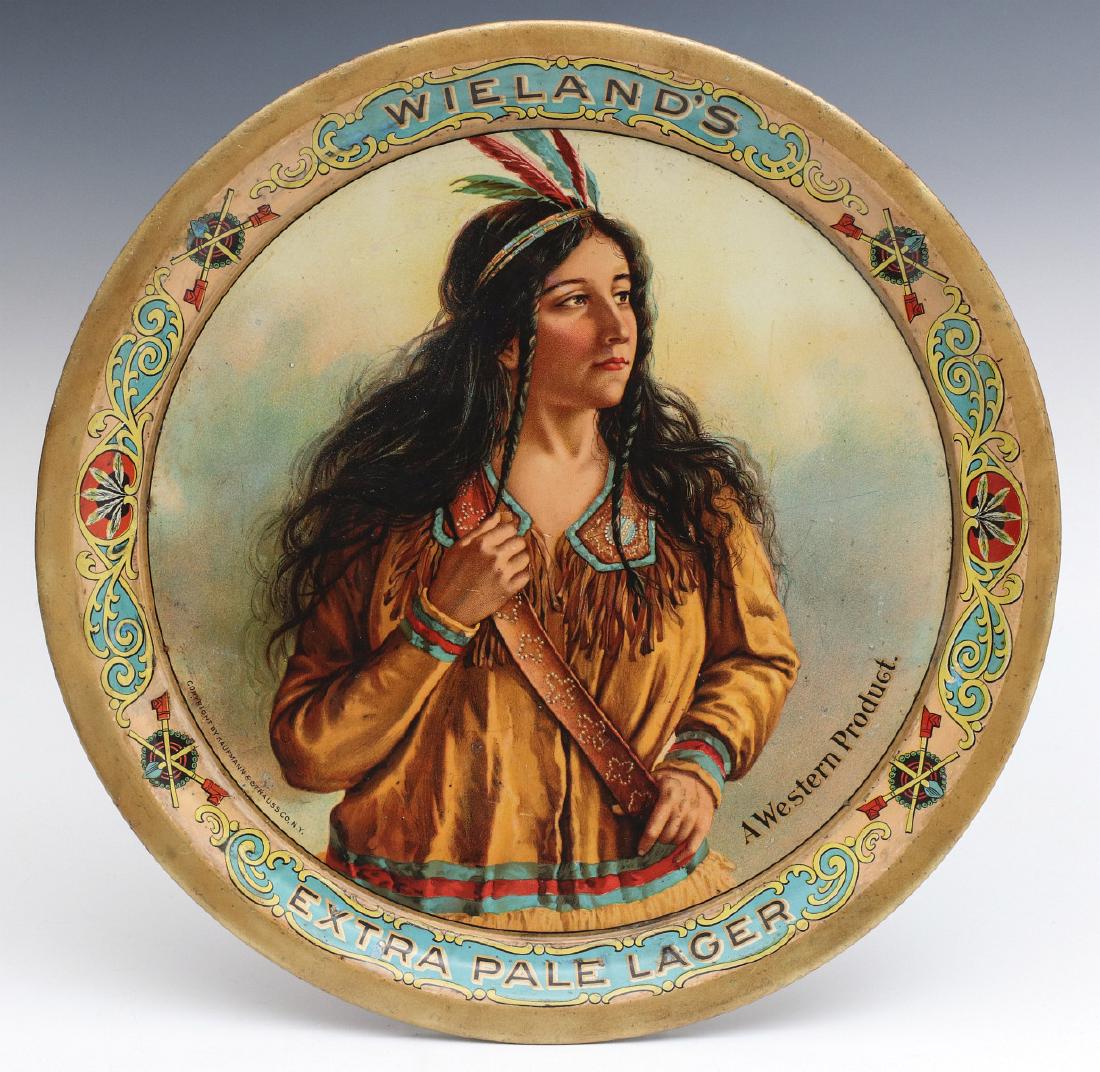 A PRE-PROHIBITION ADVTG TRAY FOR WIELAND'S LAGER: The lithographed tin tray for San Francisco brewer John Wieland, pictures an indian maiden in buckskin shirt with beaded collar and fringe, feather headdress, lettered A Western Product lower right, a