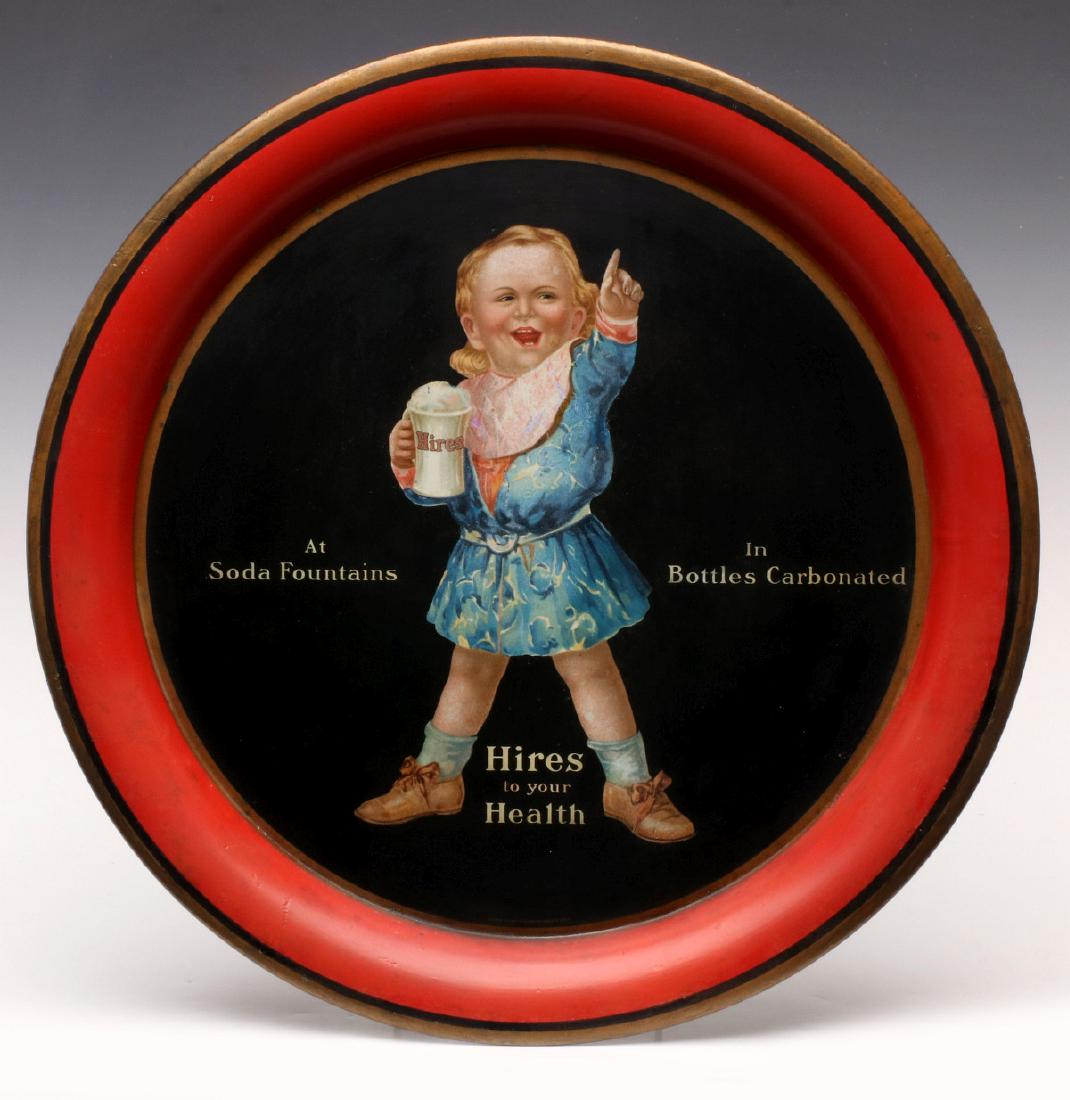 A COLORFUL HIRES ROOT BEER TIN LITHO SERVING TRAY: The round serving tray with portrait of a boy holding a mug of root beer, tagline reads 'Hires to Your Health,' polychrome lithographed tin, signed Chas. W. Shonk Co. Measures 13.25 inches in diameter