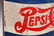 A PEPSI-COLA TIN LITHO ADVERTISING STRING HOLDER - 8