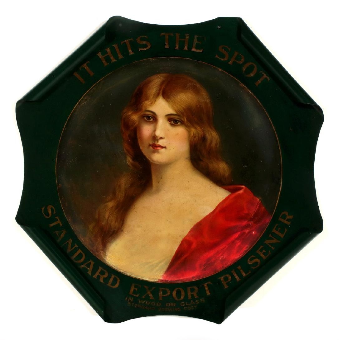 A PRE-PROHIBITION STANDARD EXPORT PILSENER SIGN: The octagonal tin sign with rolled corners, lithography portrait of a beauty, graphics and advertising 'IT HITS THE SPOT, STANDARD EXPORT PILSENER' and 'IN WOOD OR GLASS STANDARD BREWING COST.' Measur