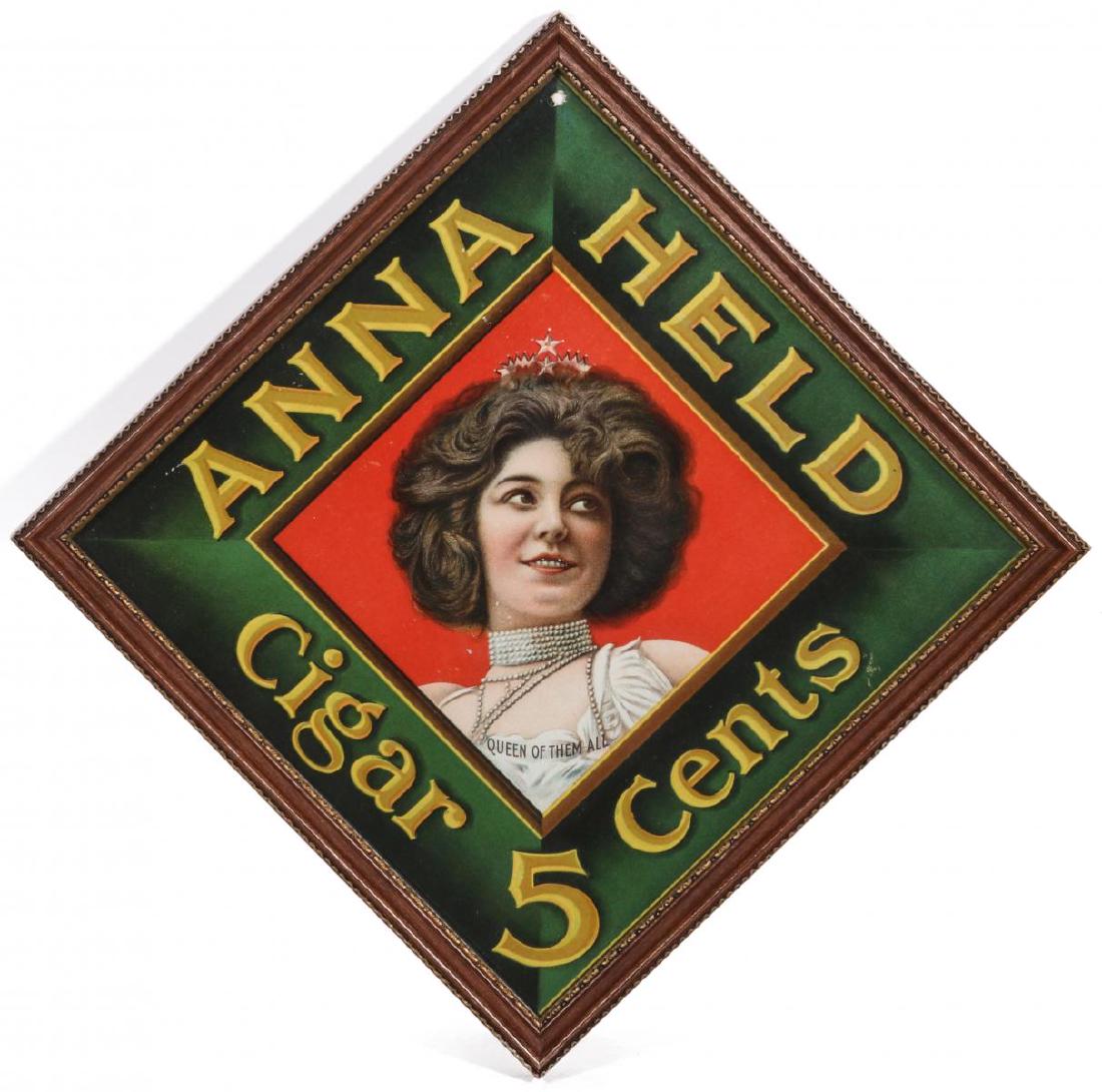 AN ANNA HELD BRAND CIGAR ADVERTISING SIGN C 1900: The chromolithograph on paper design with the portrait of a beauty titled QUEEN OF THEM ALL. Frame measures 9.25 x 9.25 inches. We happily provide seamless in-house packing and shipping services on ne