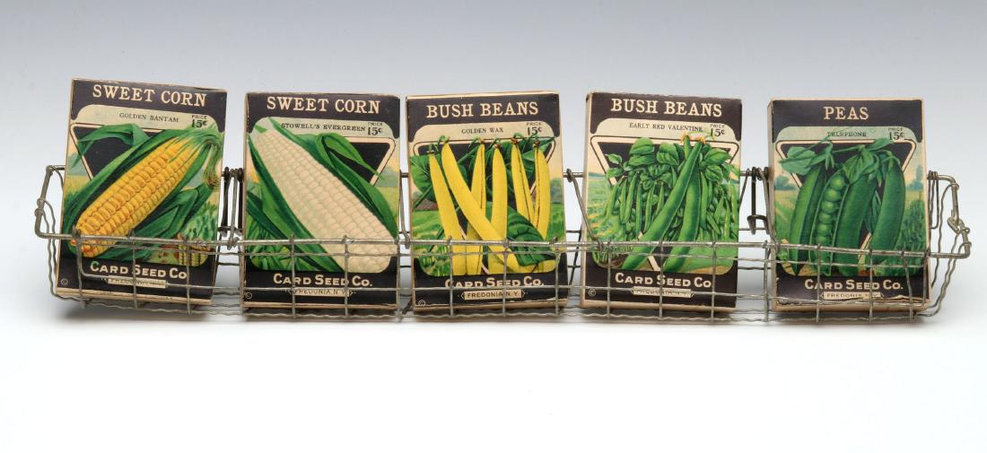 A COUNTRY STORE WIRE WARE SEED PACK DISPLAY HOLDER: The early 20th century rack with full vegetable seed packets. 2.25 x 2.25 x 17.5 inch rack plus boxes. We happily provide seamless in-house packing and shipping services on nearly everything we sell.