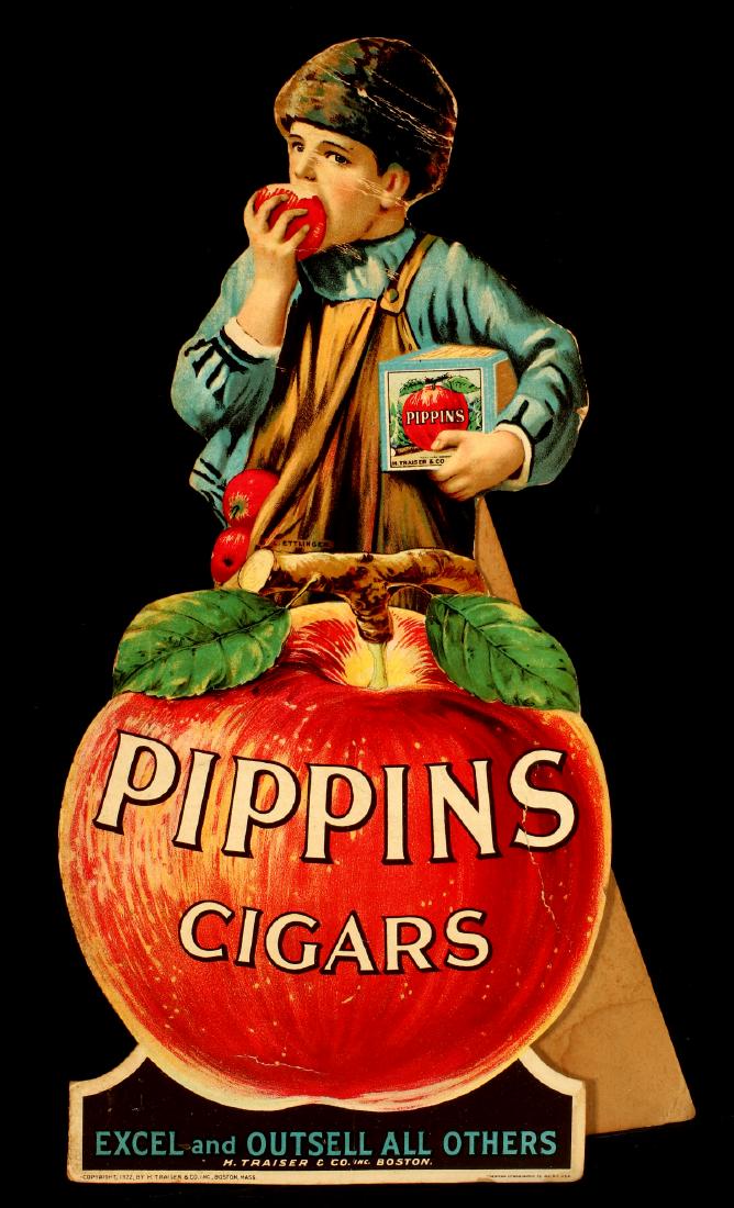 A 1922 PIPPINS CIGARS DIE-CUT TOBACCO COUNTER SIGN: A die-cut standee sign, the polychrome lithography design of a boy eating an apple and holding a cigar box, illustration signed 'L. Ettlinger,' copyright dated 1922, signed American Lithographic Co. M