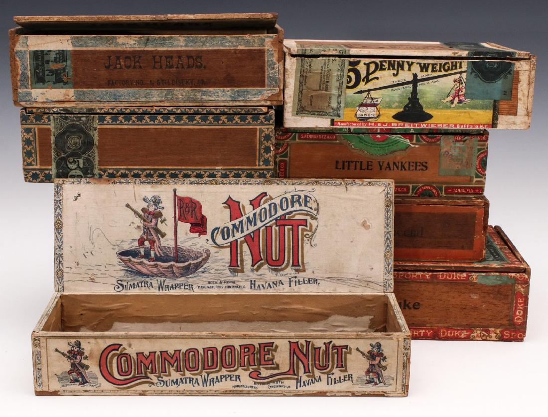 A COLLECTION OF SEVEN GOOD MAHOGANY CIGAR BOXES: Various themes and graphics as shown. Measure 2 x 7 x 4 inches up to 2.5 x 9 x 5.25 inches. We happily provide seamless in-house packing and shipping services on nearly everything we sell.