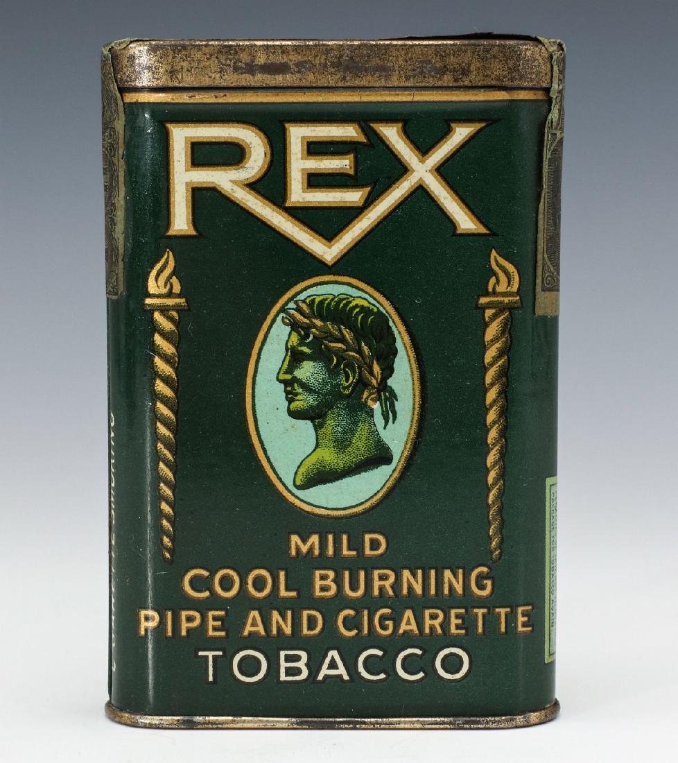 A REX BRAND TOBACCO ADVERTISING POCKET TIN: A pocket tin for REX brand pipe and cigarette tobacco by Spaulding & Merrick, four-color tin litho with hinged lid, striker on the base, a 1910 IRS tax stamp across the top. Measures 4.5 x 3 inches. W