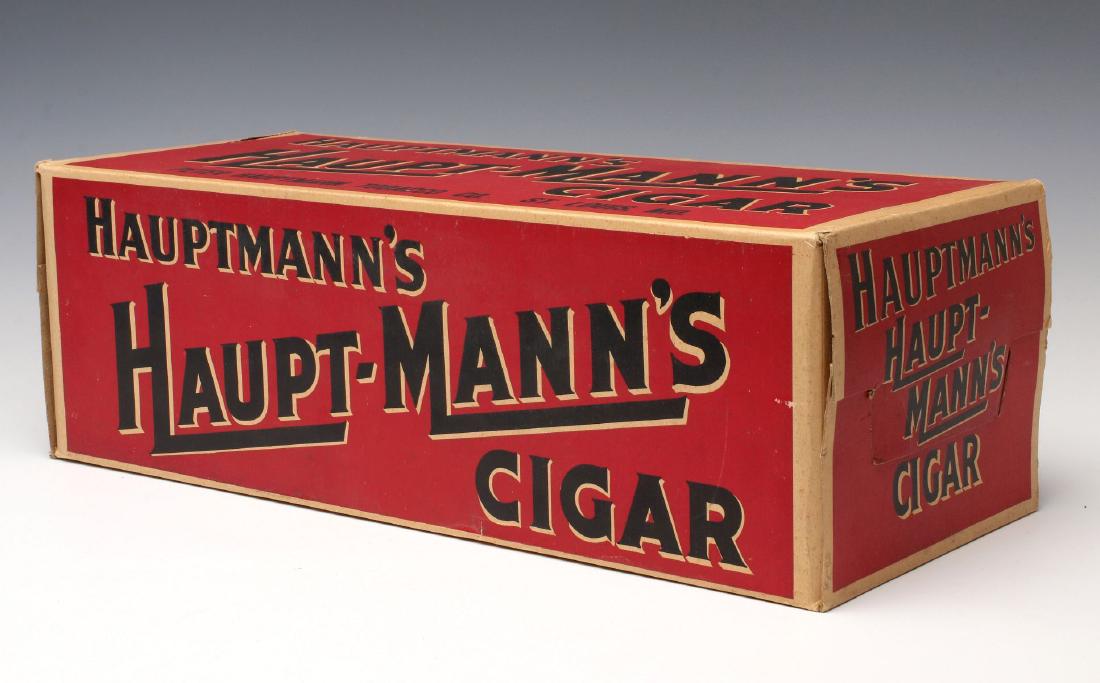 A HAUPT-MANN'S BRAND CIGAR ADVERTISING DISPLAY BOX: A cardboard advertising display box for Peter Hauptmann Tobacco Co., two-color printing with bold text on all sides. Measures 6 x 18.5 x 7.5 inches. We happily provide seamless in-house packing and sh