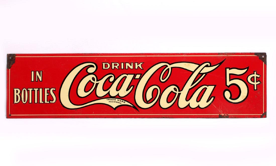 A 5c COCA COLA TIN LITHO ADVERTISING SIGN C. 1922: A three-color tin litho sign circa 1922, reads DRINK Coca-Cola IN BOTTLES 5 CENTS, similar to Petretti number PTN102. Measures 4.5 x 18 inches. We happily provide seamless in-house packing and shippin