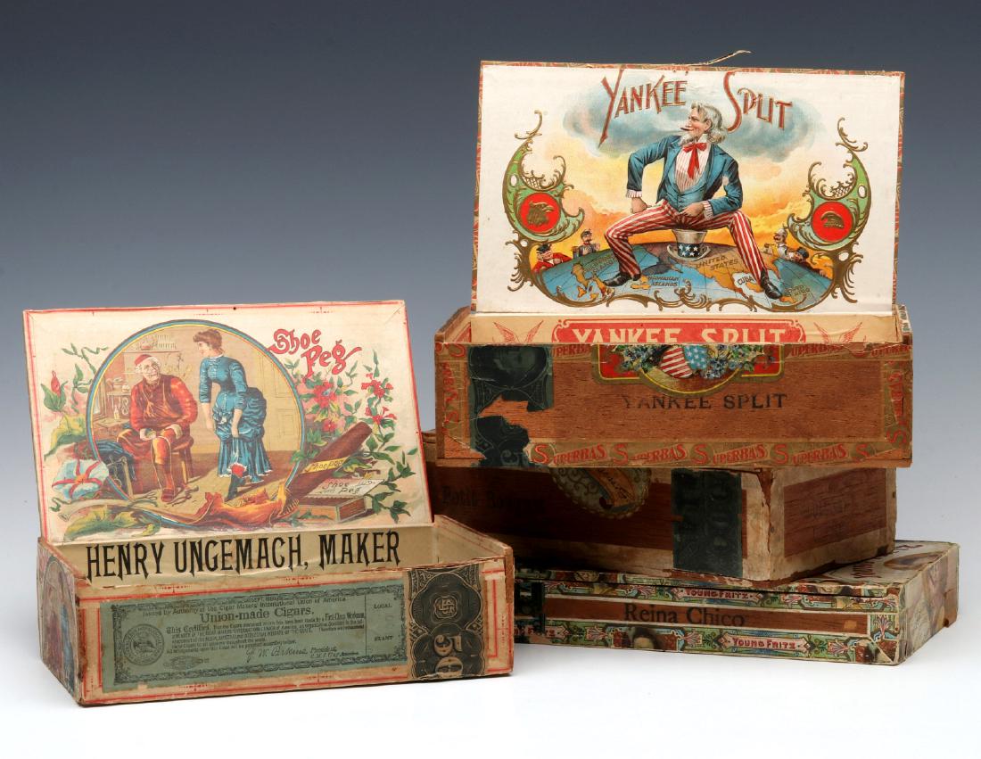 A COLLECTION OF FOUR GOOD MAHOGANY CIGAR BOXES: All with colorful labels and brands like BABY SEAL SKIN, YOUNG FRITZ, SHOE PEG and YANKEE SPLIT. Largest box measures 2.75 x 4.75 x 8.5 inches. We happily provide seamless in-house packing and shippin