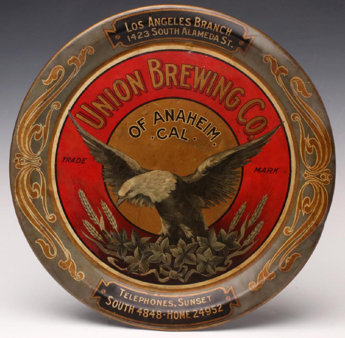 A PRE-PROHIBITION UNION BREWING CO ADVTG. SERVING TRAY: The lithographed tin tray centered by a bald eagle and a wreath of wheat, advertises the Los Angeles Branch of UNION BREWING CO of Anaheim California. Measures 12.25 inches in diameter. We happily pro