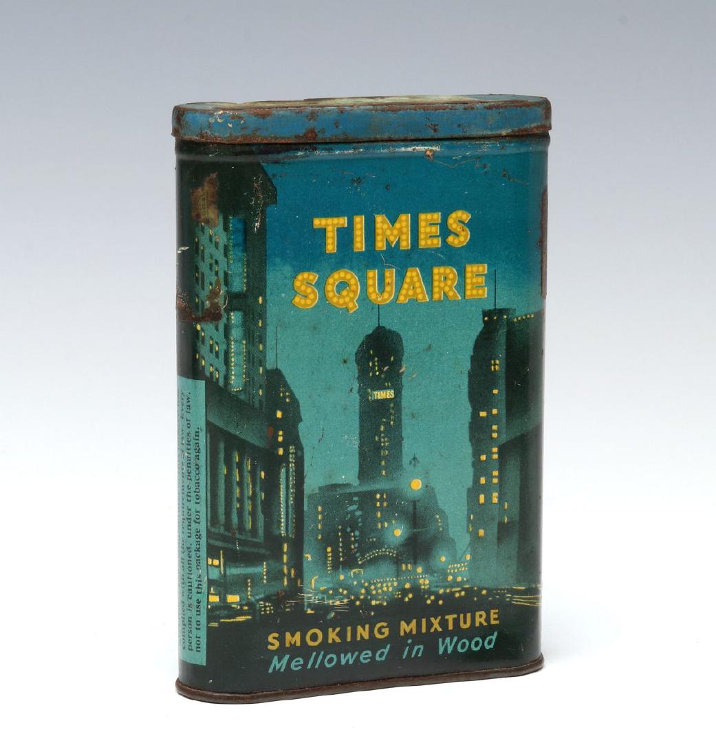 A TIMES SQUARE POCKET TOBACCO TIN: Pictures an early 20th century American city at night. Measures 4.25 x 3 inches. We happily provide seamless in-house packing and shipping services on nearly everything we sell.