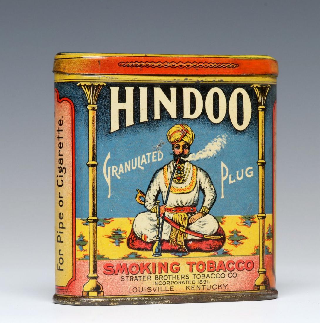 A RARE HINDOO BRAND POCKET TOBACCO TIN: A scarce tobacco pocket tin for Strater Brothers Tobacco Co. 'Hindoo' brand, polychrome tin litho with a hinged lid pictures an Indian gentleman with scimitar sword smoking a hookah pipe, partial Toba