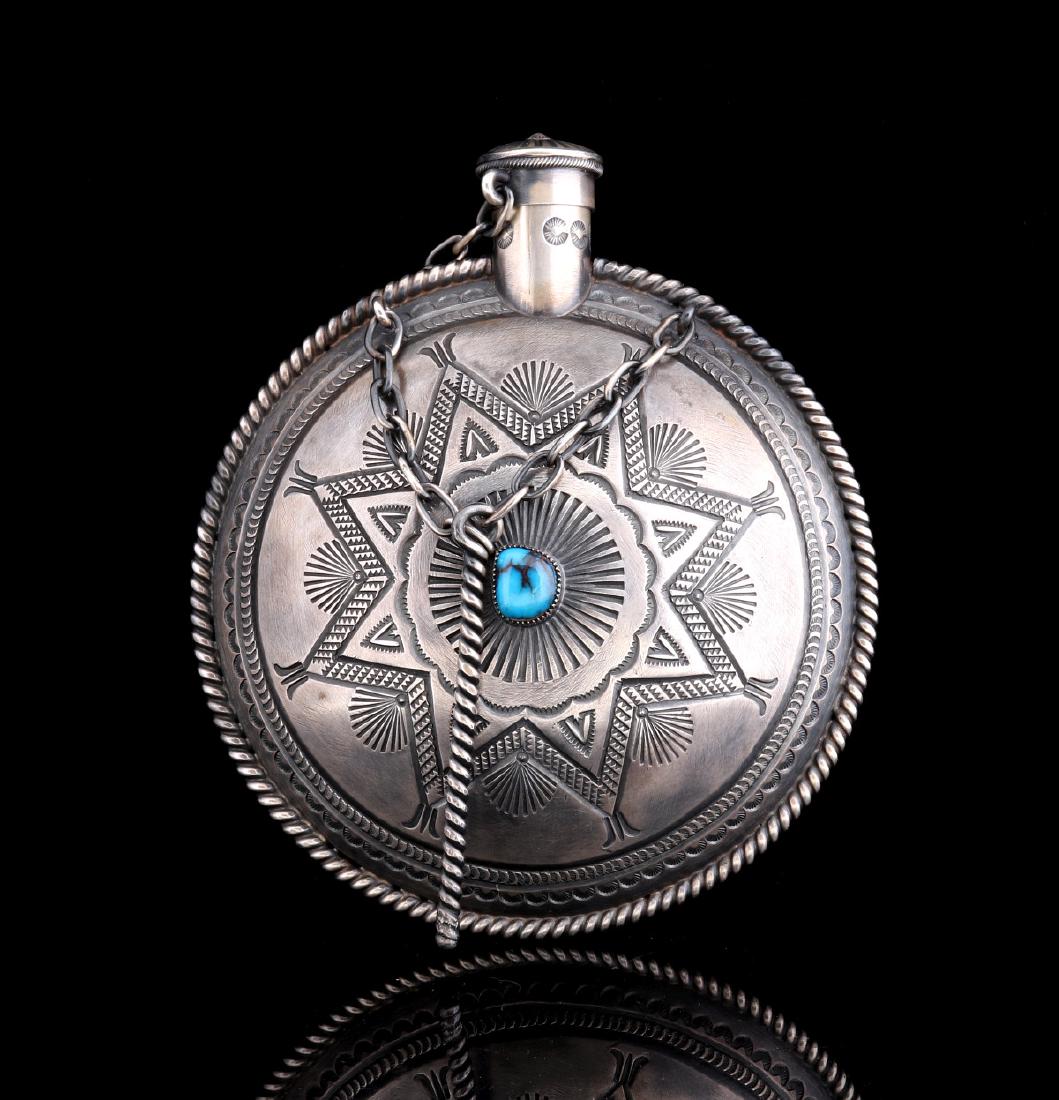 HARRY MORGAN (1946-2007) STERLING SILVER CANTEEN: The sterling silver flask set with two free-form Bisbee turquoise stones in serrated bezels, embellished overall with traditional hand stamp work and finished with a sterling rope edge, handmade sterl
