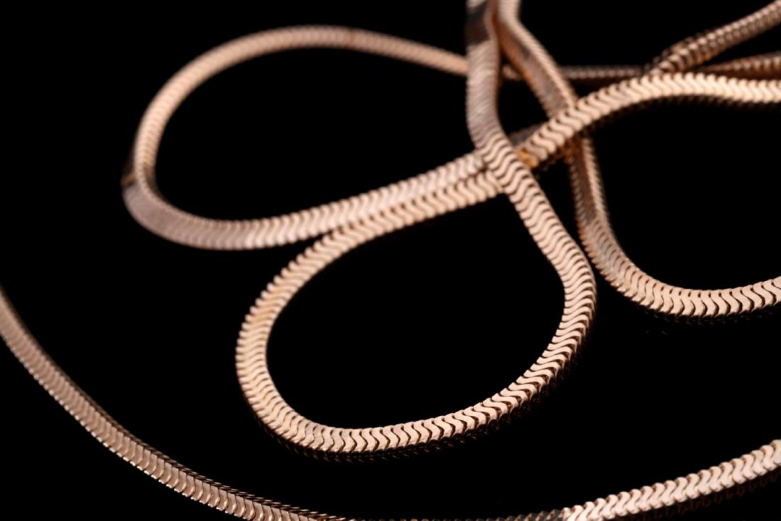 A CONTEMPORARY 14K GOLD OMEGA CHAIN NECKLACE: Marked 14k on the clasp. Measures 24 inches, weighs 9.0 grams. We happily provide seamless in-house packing and shipping services on nearly everything we sell.