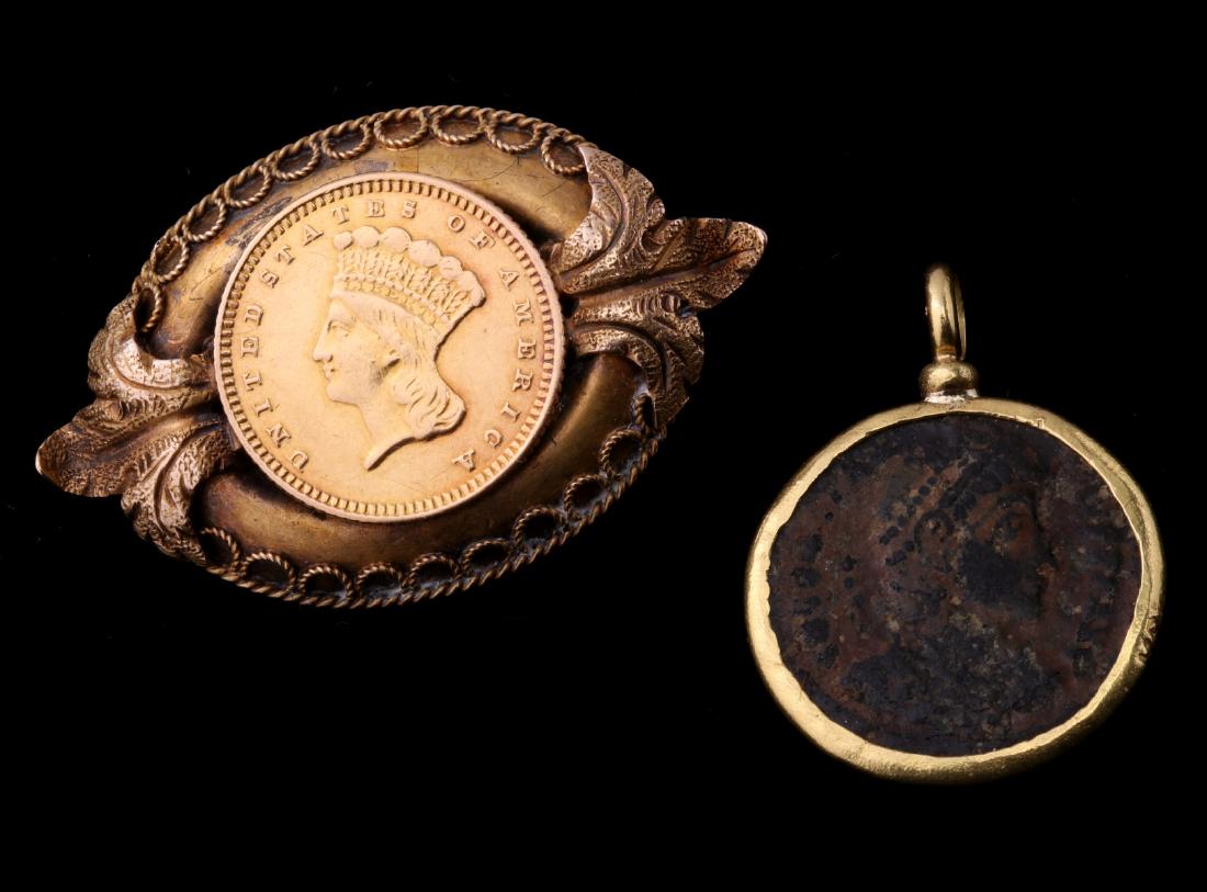 A U.S. $1 INDIAN HEAD GOLD COIN BROOCH: A 'Large Indian Head' $1 gold coin in a gold washed brooch with Etruscan work , coin dated 1873 on the reverse. Plus an ancient bronze coin in a 22k gold bezel, marked on the rim. Brooch measures 0.75