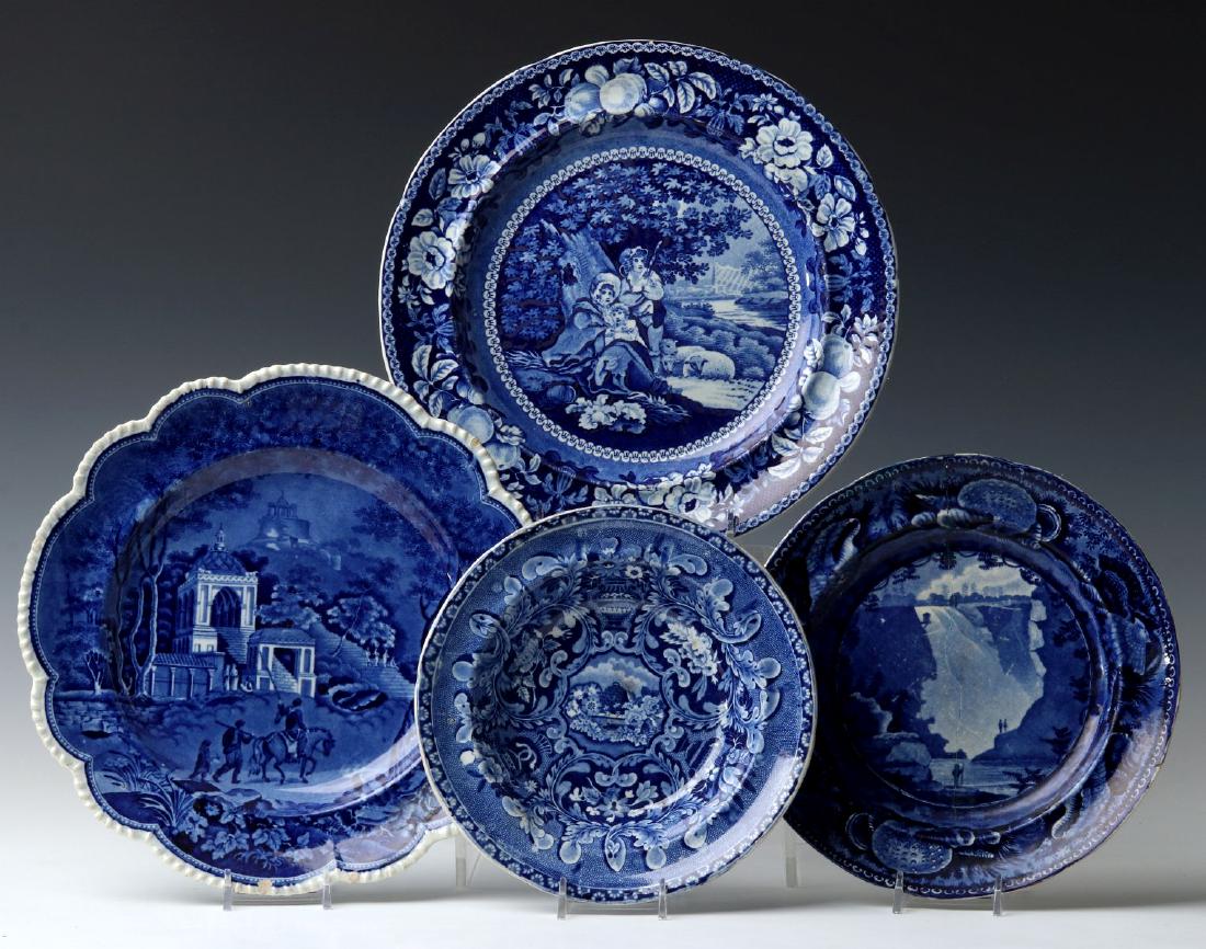 HISTORICAL STAFFORDSHIRE BLUE AND WHITE PLATES: Four blue and white Staffordshire plates, patterns include: 'Musketeer' by Rogers & Son, 'Sheltered Peasants' by Ralph Hall, 'Fall of Montmere Near Quebec' by Wood and Sons, and 'Beehive and Vase' by 