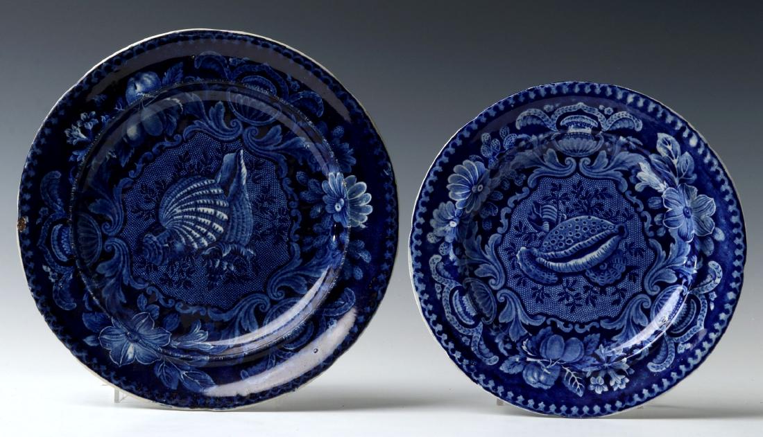 TWO HISTORICAL STAFFORDSHIRE BLUE AND WHITE PLATES: Two circa 1830 seashell pattern plates by Joseph Stubbs, signed with impressed marks on the backs. Measure 8.75 inches and 10 inches in diameter. We happily provide seamless in-house packing and shipp