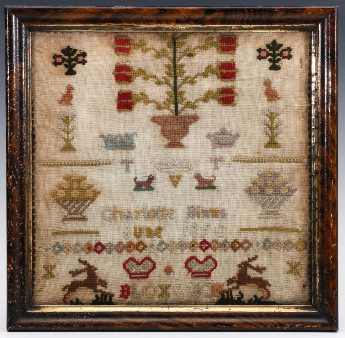 A BRITISH SCHOOL GIRL SAMPLER DATED 1870: With flowers in urn, fruit baskets, deer and other elements by Charlotte Binns. Sight size measures 11.75 x 11.75, frame is 14 x 14 inches. We happily provide seamless in-house packing and shipping se