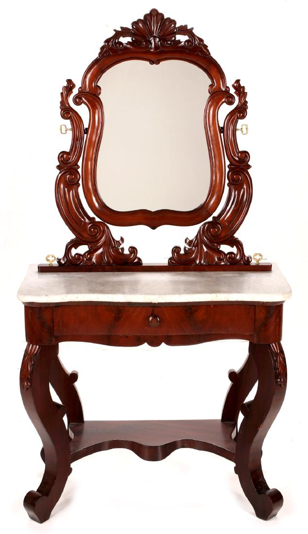 A 19TH CENT ROCOCO REVIVAL MAHOGANY DRESSING TABLE: The four cabriole legs supporting smooth face drawer and sides, shaped marble top, scrolling rococo yoke and conforming mirror with ornate brass threaded fasteners through the marble. Measures 67 x 35