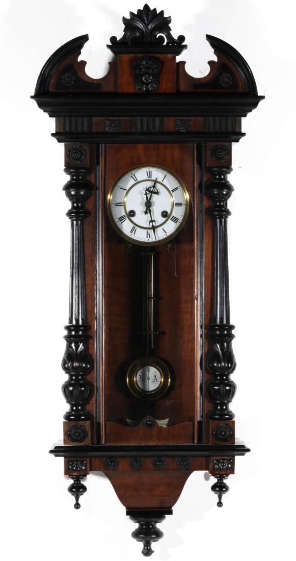 A 19TH CENT AUSTRIAN OR GERMAN RA WALL REGULATOR: Th walnut case with ebonized highlight, the crown with open pediment centered by a ladies head, a frieze with short vertical moldings and rosettes over the door with its half-columns, lower bracket wi