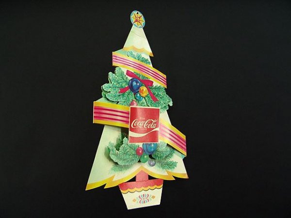 1970'S COCA-COLA HANGING X-MAS TREE AD: It measures 24 1/4" tall by 12" wide. It has a couple of creases. Should be considered in good condition.