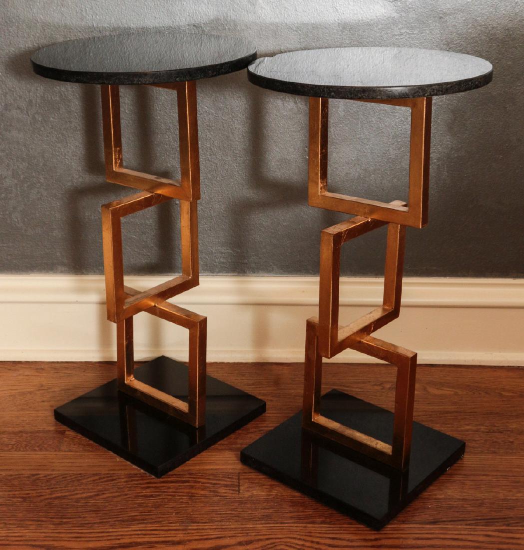 A PAIR MODERN DESIGN OCCASIONAL SIDE TABLES: Two tall stands, stacked brass squares with black marble. Measures 23 x 12.75 inches. We happily provide seamless in-house packing and shipping services on nearly everything we sell.