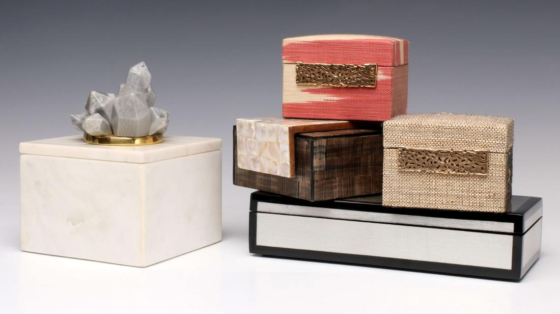 A COLLECTION OF INTERESTING ELEGANT STORAGE BOXES: A white marble box with faux minerals, cloth covered examples with filigree, other elegant examples with pearl veneer and other finishes. Measurements range from 2.75 x 3.75 x 3 to 6.5 x 5 x 5 inches.