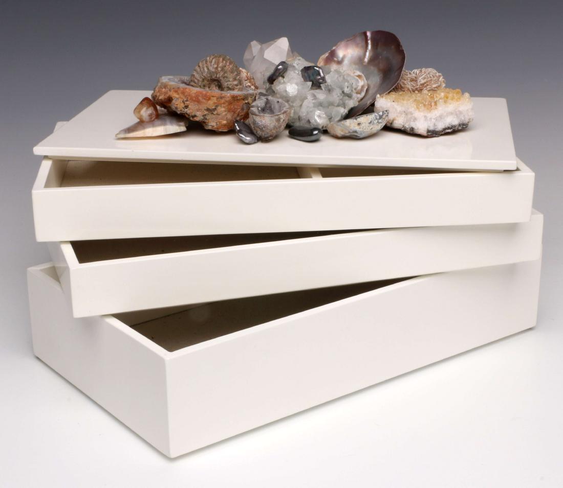 A BRENDA HOUSTON LACQUER BOX WITH SHELL AND GEODES: Custom made by Brenda Houston for the present owner. Lacquer box, lid embellished with minerals including selenite, rose gypsum, citrine, split geodes, sea fossil and shell. Three tiers with cloth lin