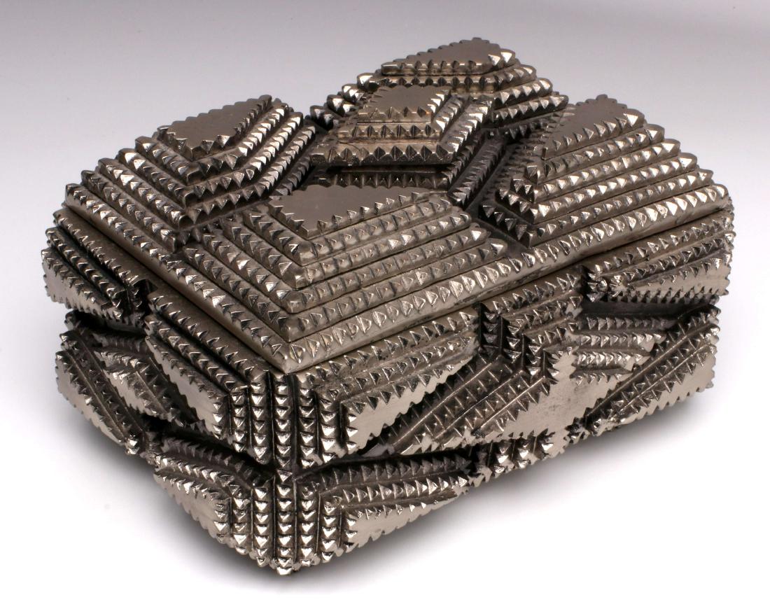 A CONTEMPORARY TRAMP ART-LIKE BOX: The molded and silvered composite imitating the chip-carved technique of early 20th century 'Tramp Art.' Measures 4.75 x 6 x 8.25 inches. We happily provide seamless in-house packing and shipping serv