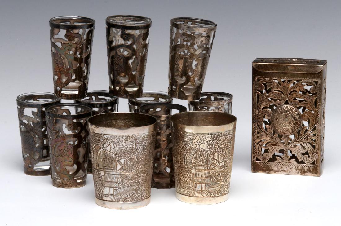 SANBORNS AND OTHER MEXICAN STERLING OBJECTS: Two hand worked beakers, a cigarette box an glassware with sterling overlay. Measurements range from 2.4 to 3.5 inches. We happily provide seamless in-house packing and shipping services on nearly eve