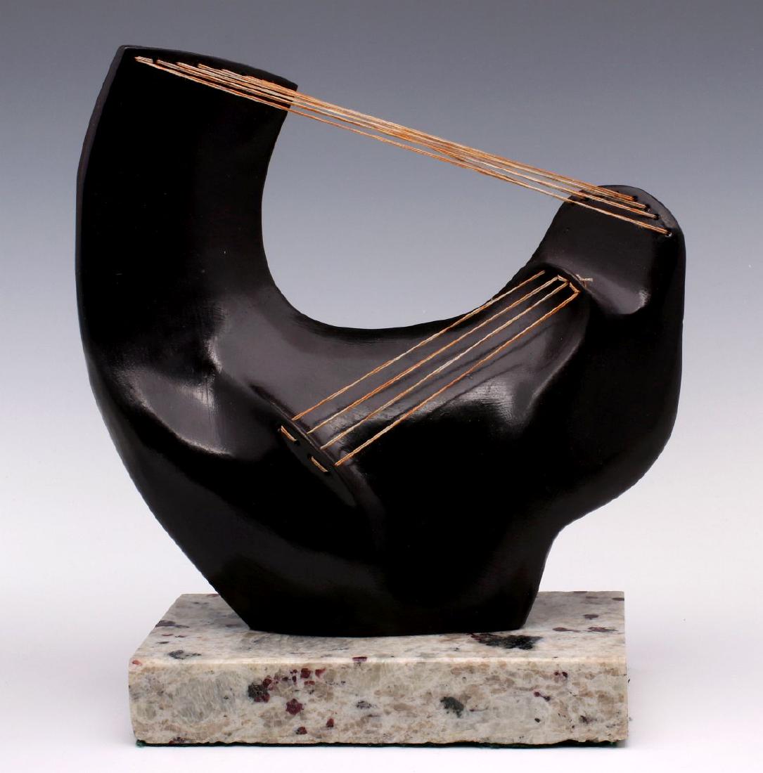 A STRINGED FIGURAL BRONZE SCULPTURE AFTER MOORE: AFTER Henry Moore, cast name and number 8/9. Measures 10 x 9 inches. We happily provide seamless in-house packing and shipping services on nearly everything we sell.