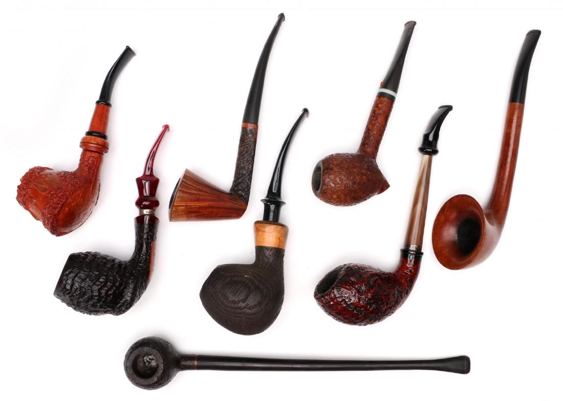 A COLLECTION OF EXOTIC HAND CARVED SMOKING PIPES: Signed examples include: Ser Jacopo 'O4'; Marchvelli Pipes #O75VC; Bob Gilbert #123 11; Connoisseur 'Burak'; Ardor 'Fantasy' dated 2005; a dark wooden pipe with a blond shank illegibly signed; a Ser J