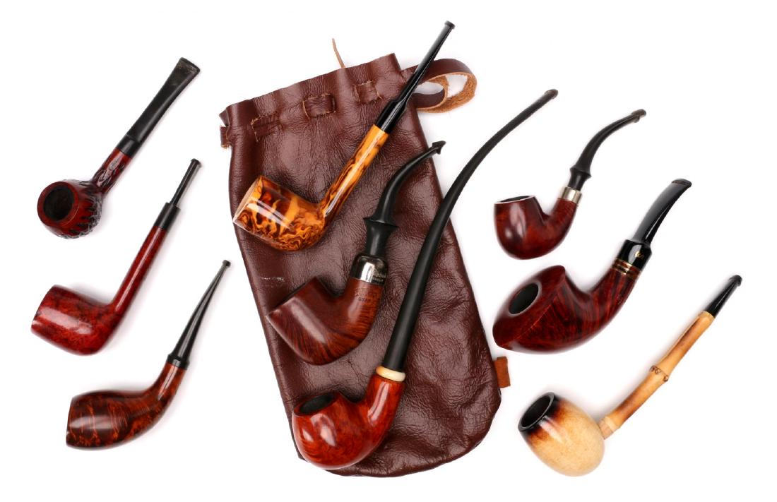 A COLLECTION OF QUALITY EXOTIC WOOD SMOKING PIPES: Signed examples include: Hilson 'Fantasia'; Stanwell 'Rondo'; Peterson 'Star' with a sterling band; Shalom burl pipe; Nording long stem pipe. Plus four unsigned pipes. Measure 4.5 to 10 inches. We hap