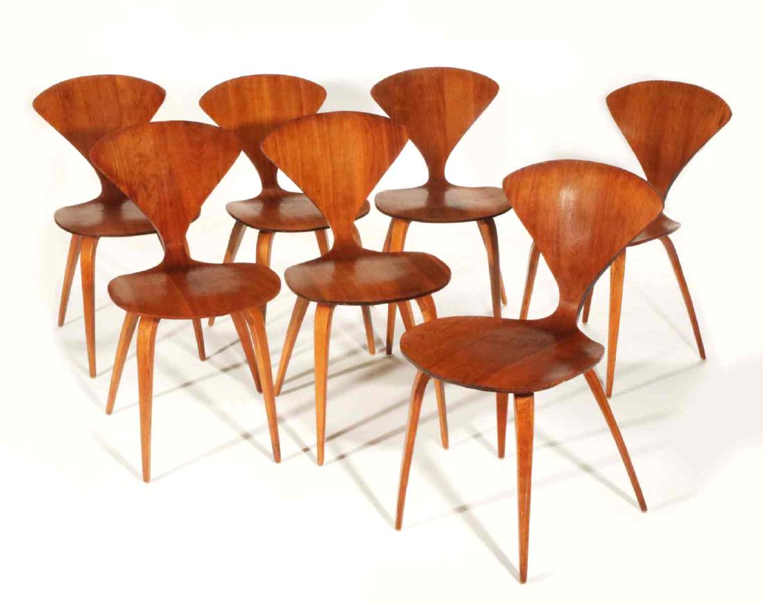 A SET OF SEVEN CHERNER SIDE CHAIRS SIGNED PLYCRAFT: Seven molded plywood side chairs, circa 1960, designed by Norman Cherner (1920-1987), manufactured by Plycraft in Lawrence, Massachusetts, paper label under the seat. Measure 31.5 x 17 x 18 inches eac