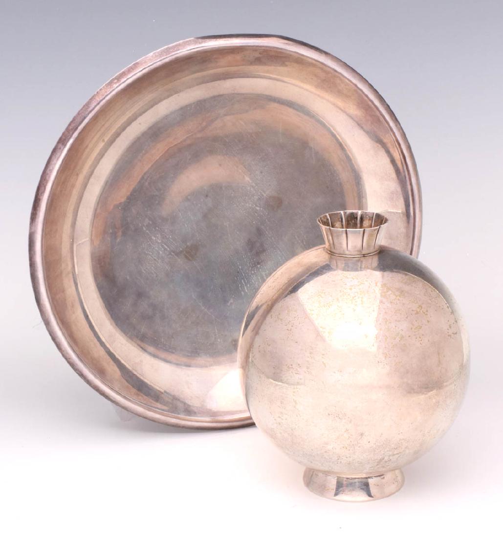 AMERICAN MODERN DESIGN STERLING SILVER HOLLOWARE: The bowl with rolled rim on circular foot with reeded edge, signed R. WALLACE STERLING, 2230. Plus a disc form pillow vase with cut and flared neck, set on flaring rim base, stamped marking Gorham STE