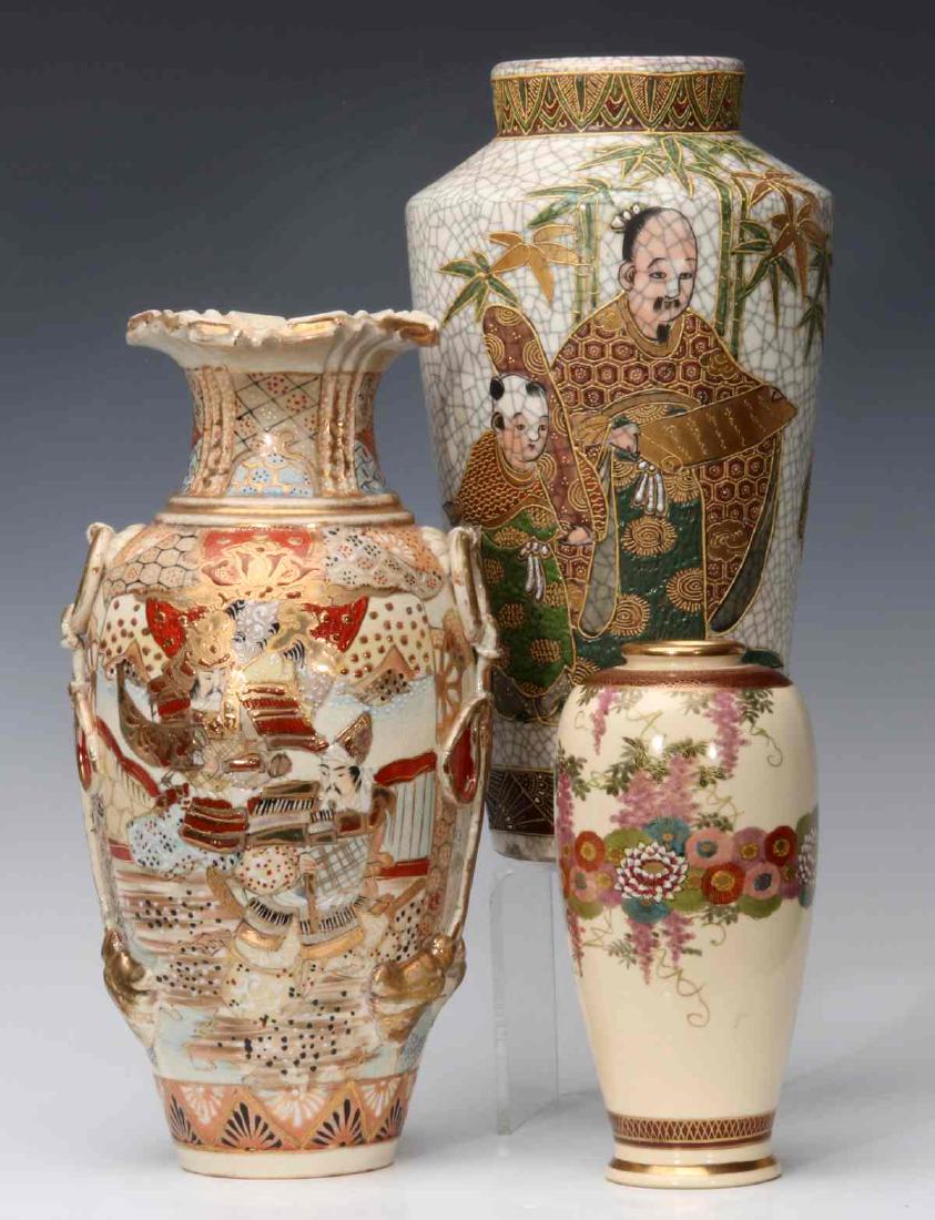 A GROUP OF THREE JAPANESE SATSUMA POTTERY VASES: Meiji and Edo period examples: the largest being a Meiji period vase with ring handles and molded hanging tassels, raised enamels and beaded decoration. The fine and distinctive example with black cra