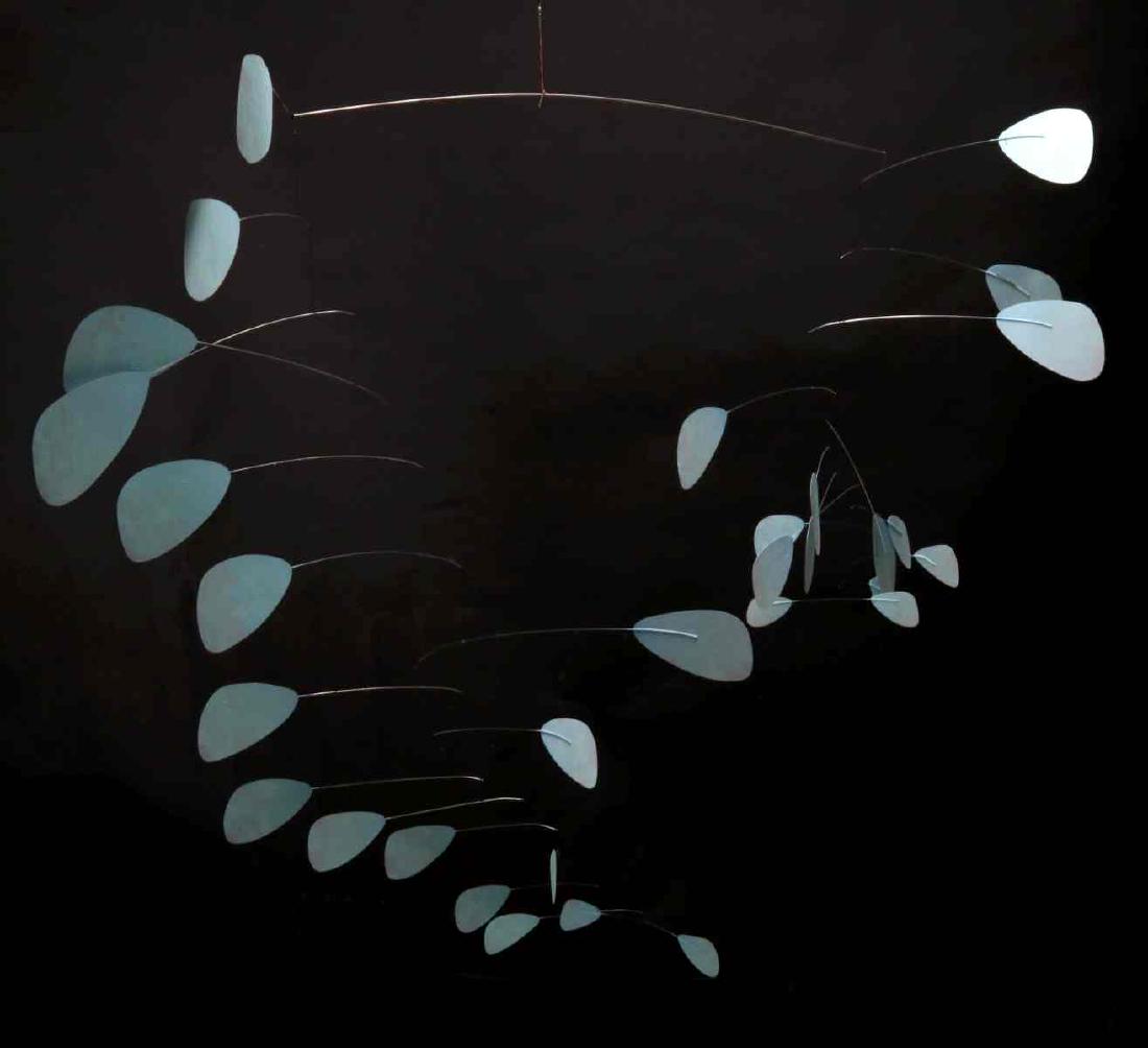 A LATE 20TH CENTURY MOBILE SCULPTURE: Circa 1980. A large kinetic sculpture comprised of more than sixty painted enameled vinyl paddles on rods engineered with the equilibrium necessary to create an impressive hanging sculptural display. 
