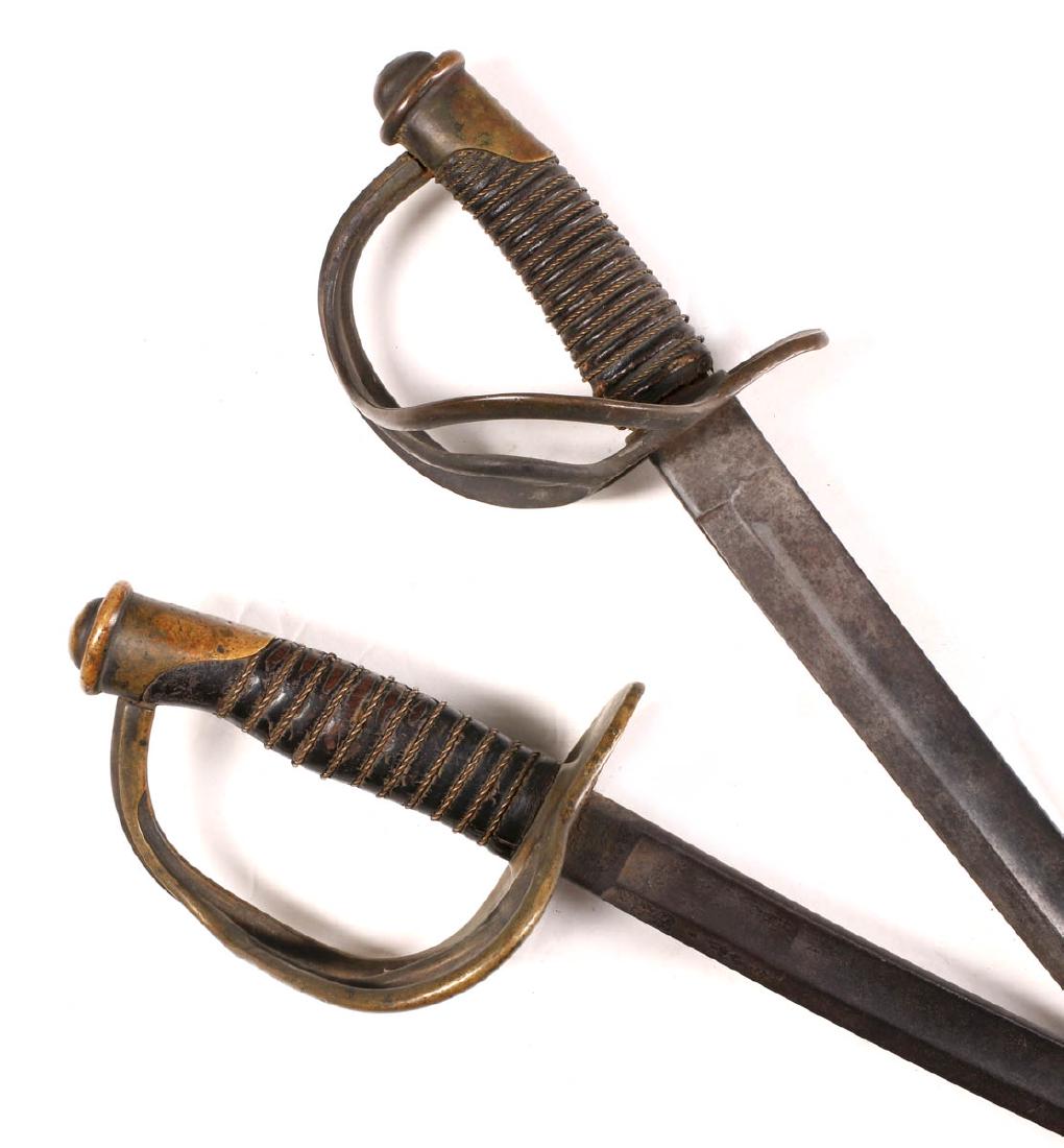 TWO US CIVIL WAR ERA M1860 CAVALRY SABERS: One German made and signed 'W. Wasche, Solingen' on the ricasso, other unmarked; both with wire wrapped leather grips, no scabbards. Measure 40.5 inches and 41 inches. We happily provide seamless in-h