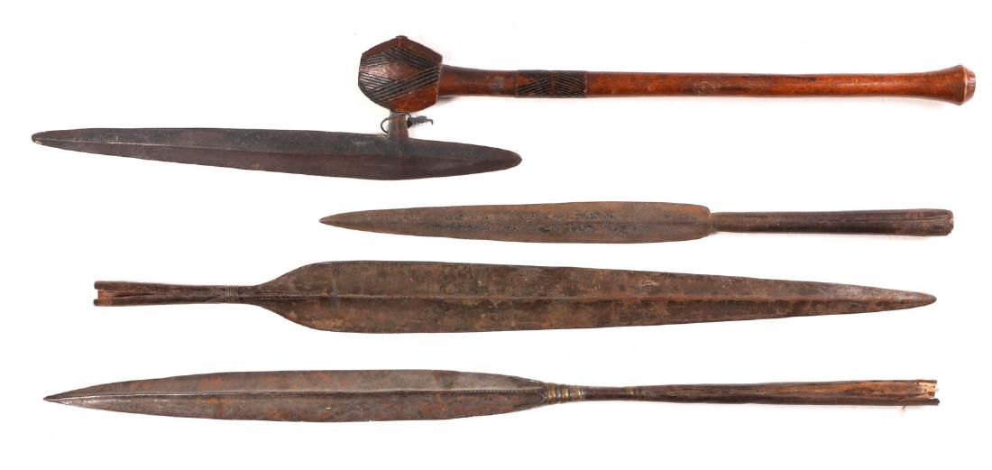 AN AFRICAN STABBING AXE AND THREE SPEAR HEADS: A south African Tsonga or Venda region stabbing axe with hand carved wooden grip and shaft; three hand forged socketed spears. Axe measures 28.5 inches overall, spears range from 19.25 inches to 27.5 