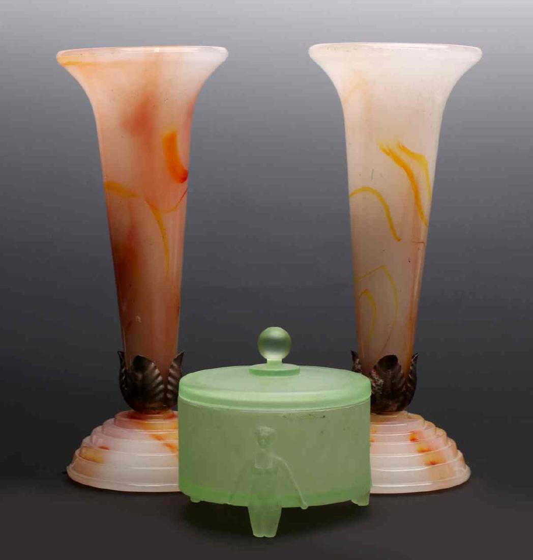 ART DECO ERA ART GLASS ACCESSORIES: A pair of caramel slag table torchiere lamps of Akro Agate type glass, unsigned. Plus a frosted green glass Art Deco powder jar, the circular container with cover supported by three flappers in bathin